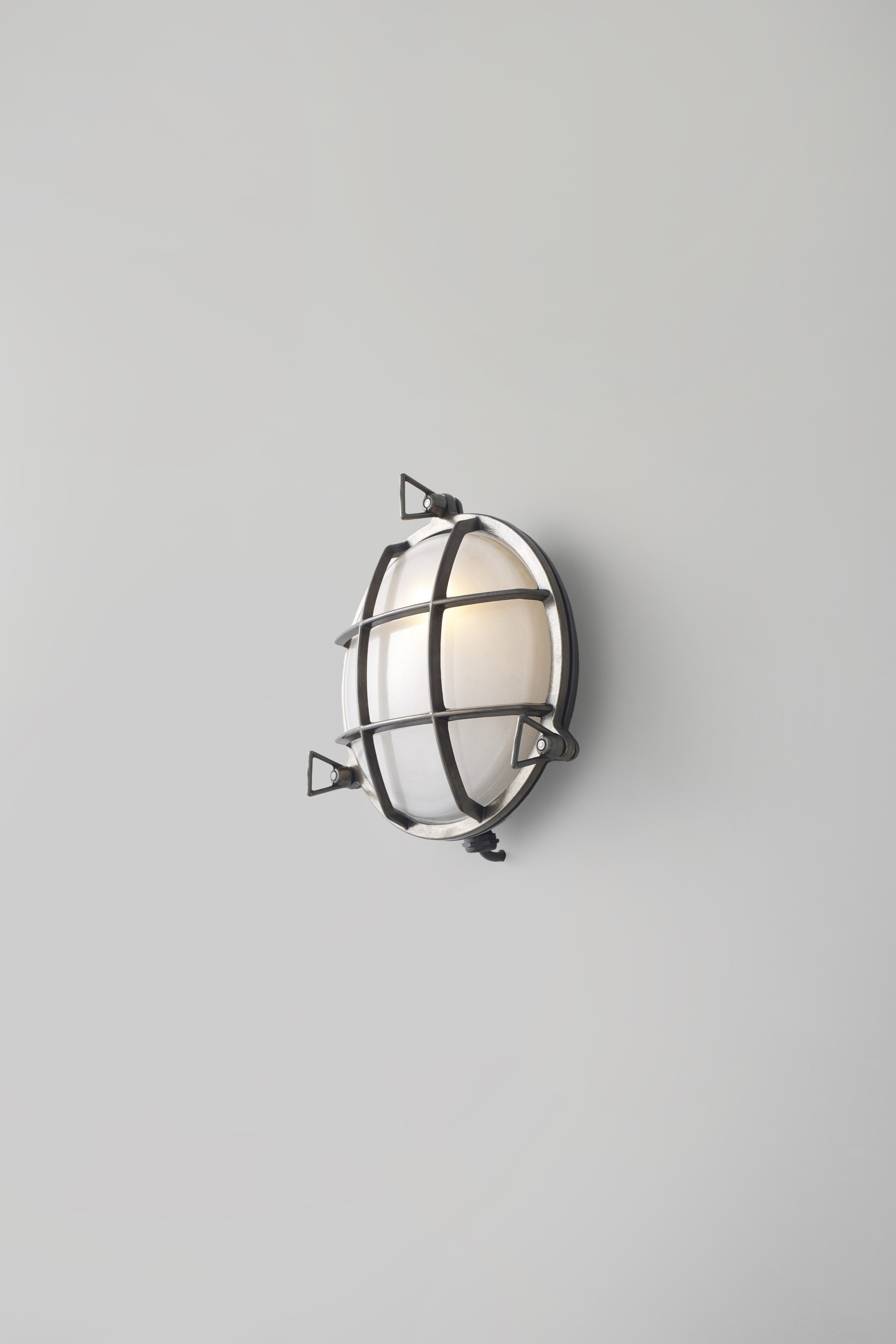 OBTC Product Image, Light On: 7027 Brass Bulkhead, Weathered Brass, Frosted Glass, Davey Lighting Range