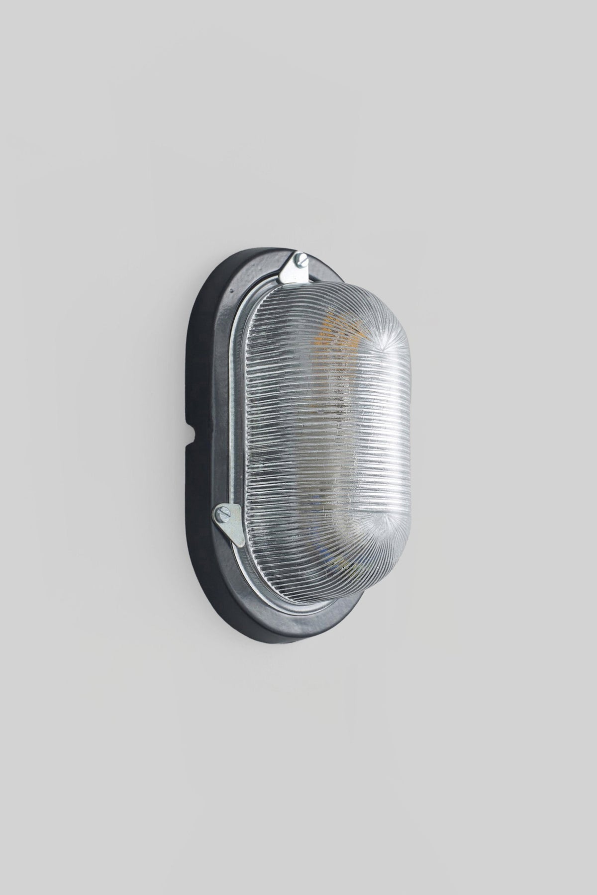 OBTC Product Image, Light Off: Oval Aluminium Bulkhead for GLS 7001, Black, Prismatic Glass, Davey Lighting Range