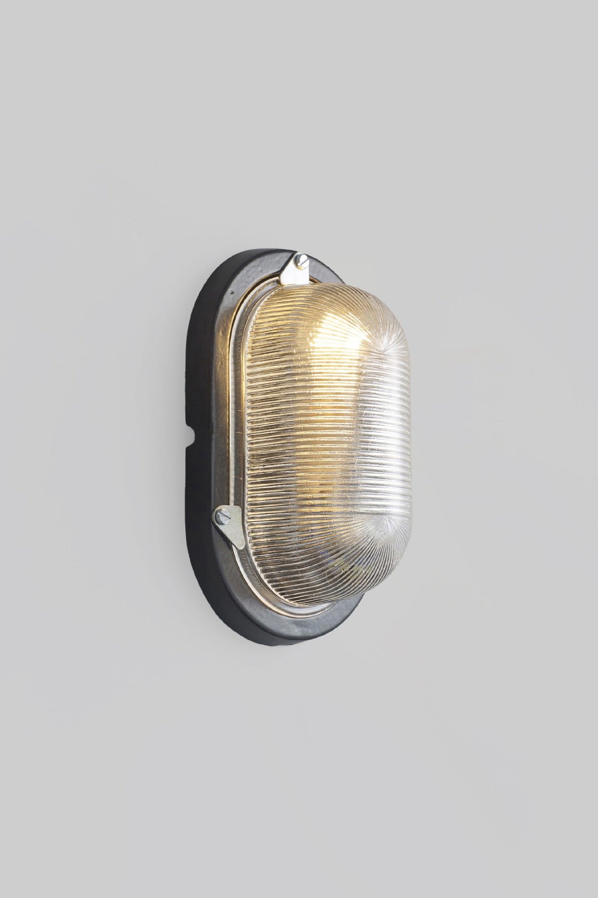 OBTC Product Image, Light On: Oval Aluminium Bulkhead for GLS 7001, Black, Prismatic Glass, Davey Lighting Range