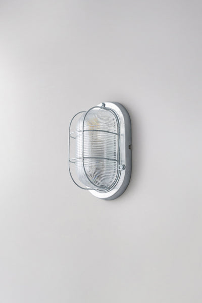 OBTC Product Image, Light Off: Oval Aluminium Bulkhead for GLS 7003, Silver, Prismatic Glass, Davey Lighting Range