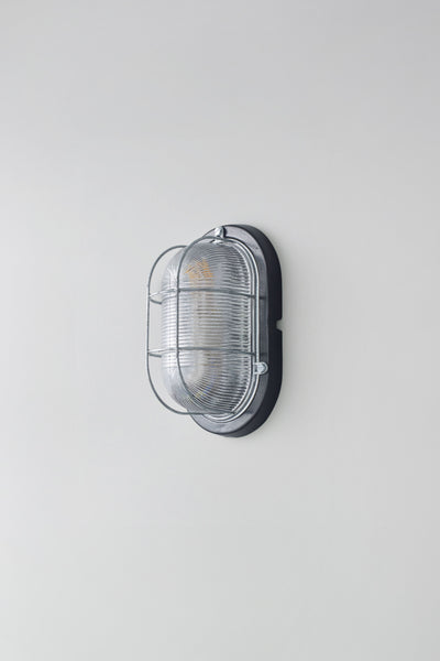 OBTC Product Image, Light Off: Oval Aluminium Bulkhead for GLS 7003, Black, Prismatic Glass, Davey Lighting Range