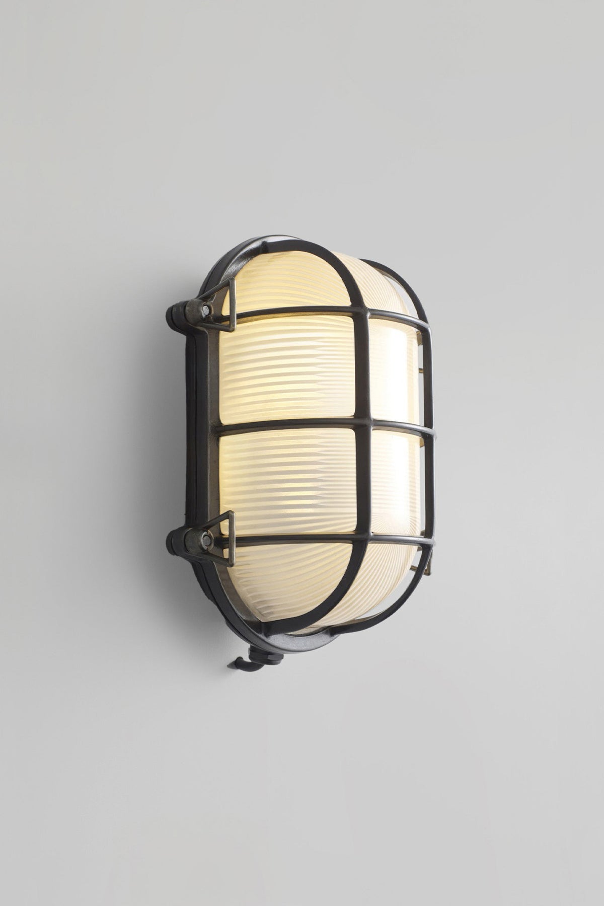 OBTC Product Image, Light Off: Oval Brass Bulkhead 7034, Weathered Brass, Frosted Prismatic Glass, Davey Lighting Range